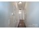 Bright hallway features hardwood floors and leads to the front door at 9760 Springholm Dr, Charlotte, NC 28278