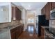 Functional kitchen featuring stainless steel appliances, granite counters, and hardwood floors at 9760 Springholm Dr, Charlotte, NC 28278