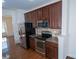 Kitchen with stainless steel appliances, granite countertops, and hardwood floors at 9760 Springholm Dr, Charlotte, NC 28278