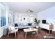 Bright living room with modern furniture, stylish decor, and beautiful hardwood floors at 9760 Springholm Dr, Charlotte, NC 28278