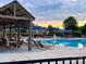 Community pool with chairs and tables under a gazebo at 9760 Springholm Dr, Charlotte, NC 28278