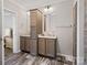 Bathroom featuring double vanities and storage cabinets at 1005 Maywood St, Kannapolis, NC 28081