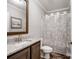 Bathroom features granite vanity and a city themed shower curtain for a unique style at 1005 Maywood St, Kannapolis, NC 28081