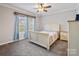 Bright bedroom with a ceiling fan, plush carpet, and large window at 1005 Maywood St, Kannapolis, NC 28081