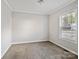 Empty bedroom showing carpeting and natural light from the window at 1005 Maywood St, Kannapolis, NC 28081