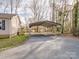 Exterior shot of a spacious driveway leading to the covered two car carport at 1005 Maywood St, Kannapolis, NC 28081