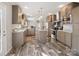 Open kitchen features stainless appliances, gray cabinetry, island with granite countertop, and hard surface floors at 1005 Maywood St, Kannapolis, NC 28081