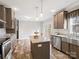 Open kitchen design featuring a central island, stainless appliances, and warm cabinetry at 1005 Maywood St, Kannapolis, NC 28081