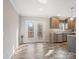 Well-lit kitchen area with access to patio, stainless steel appliances, and stylish countertops at 1005 Maywood St, Kannapolis, NC 28081