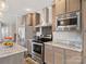 Modern kitchen featuring stainless steel appliances and beautiful countertops and cabinetry at 1005 Maywood St, Kannapolis, NC 28081