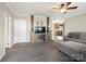 Open concept living room with neutral tones and a view to the kitchen at 1005 Maywood St, Kannapolis, NC 28081