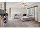 Spacious living room featuring a sectional sofa, a fan, and views to outside at 1005 Maywood St, Kannapolis, NC 28081