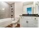 Modern bathroom featuring a gray tiled shower and a white vanity with dark hardware at 108 Ellsworth Rd # 40, Mooresville, NC 28115