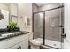 Modern bathroom features gray subway tile in shower with black fixtures, and a granite countertop vanity with black faucet at 108 Ellsworth Rd # 40, Mooresville, NC 28115