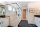Elegant bathroom with tiled shower, granite vanity, and view to a walk-in closet. Offers sophistication and functionality at 108 Ellsworth Rd # 40, Mooresville, NC 28115
