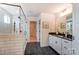Bathroom with a tile shower and a granite-topped vanity, offers a modern and luxurious feel at 108 Ellsworth Rd # 40, Mooresville, NC 28115