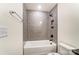 Bathroom featuring gray subway tile, tub with shower, and modern fixtures at 108 Ellsworth Rd # 40, Mooresville, NC 28115