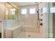Modern bathroom features a glass shower with tiled walls and two built-in seats at 108 Ellsworth Rd # 40, Mooresville, NC 28115