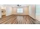 Spacious bonus room with stylish wood-look flooring, ceiling fan and recessed lights; a cozy addition to any home at 108 Ellsworth Rd # 40, Mooresville, NC 28115