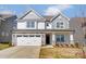 Charming two-story home with stone accents and well-manicured lawn, creating a welcoming curb appeal at 108 Ellsworth Rd # 40, Mooresville, NC 28115