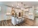 Modern kitchen with a large island, stainless steel appliances, and pendant lighting at 108 Ellsworth Rd # 40, Mooresville, NC 28115