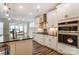 Bright, white kitchen with modern appliances, including a double oven and gas cooktop at 108 Ellsworth Rd # 40, Mooresville, NC 28115