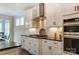 Close up of the kitchen featuring white cabinets, stainless steel appliances, and a subway tile backsplash at 108 Ellsworth Rd # 40, Mooresville, NC 28115