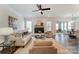 Cozy living room with a fireplace and view into dining and kitchen area at 108 Ellsworth Rd # 40, Mooresville, NC 28115