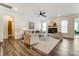 Comfortable living room with a fireplace, ample seating, and large windows at 108 Ellsworth Rd # 40, Mooresville, NC 28115