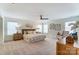 Spacious main bedroom with neutral carpet, ceiling fan, and an abundance of natural light from multiple windows at 108 Ellsworth Rd # 40, Mooresville, NC 28115