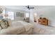 Serene main bedroom with a ceiling fan, neutral tones, two windows and a door to the ensuite bathroom at 108 Ellsworth Rd # 40, Mooresville, NC 28115