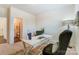 Home office with a vintage desk and view into ensuite bathroom at 108 Ellsworth Rd # 40, Mooresville, NC 28115