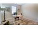 Home office with vintage desk, art and accent chair at 108 Ellsworth Rd # 40, Mooresville, NC 28115