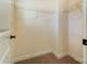 Spacious walk-in closet with beige carpet and white wire shelving for ample storage at 108 Ellsworth Rd # 40, Mooresville, NC 28115