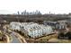 Aerial view showcasing modern townhomes with rooftop terraces against the cityscape at 1108 Wesley Terrace Ave, Charlotte, NC 28208