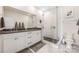 Bathroom featuring double sinks, a walk-in shower, and modern fixtures at 1108 Wesley Terrace Ave, Charlotte, NC 28208