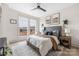 Bright bedroom featuring large windows, hardwood floors, and stylish décor at 1108 Wesley Terrace Ave, Charlotte, NC 28208