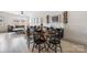 Stylish dining area and living room with a wooden table, black chairs, and a comfortable gray sectional at 1108 Wesley Terrace Ave, Charlotte, NC 28208