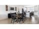 Modern dining area with a round wooden table, black chairs, and sleek decor creating a stylish and inviting space at 1108 Wesley Terrace Ave, Charlotte, NC 28208
