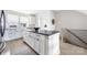 Modern white kitchen with a large center island and stainless steel appliances at 1108 Wesley Terrace Ave, Charlotte, NC 28208