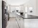 Chic kitchen with large island, stainless steel appliances, and light wood floors at 1108 Wesley Terrace Ave, Charlotte, NC 28208