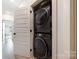 Closet laundry with stacked washer and dryer appliances at 1108 Wesley Terrace Ave, Charlotte, NC 28208