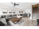 Bright, open living room with a large sectional sofa, modern decor and hardwood floors at 1108 Wesley Terrace Ave, Charlotte, NC 28208