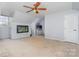 Bonus room with an angled ceiling, two aquariums, and a door at 1245 Periwinkle Dr, Waxhaw, NC 28173