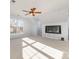 This bright, carpeted bonus room features high ceilings, a ceiling fan, built-in fish tank, and large windows at 1245 Periwinkle Dr, Waxhaw, NC 28173