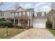 Traditional two-story home featuring gray siding, blue shutters, a landscaped front yard and attached garage at 1245 Periwinkle Dr, Waxhaw, NC 28173