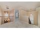 Upstairs hallway with carpet, unique light fixtures, and decorative railings at 1245 Periwinkle Dr, Waxhaw, NC 28173