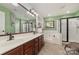 Main bathroom with double vanity, soaking tub, and glass shower enclosure at 1245 Periwinkle Dr, Waxhaw, NC 28173