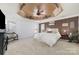 Spacious main bedroom boasts a tray ceiling with fan, neutral carpet, and decorative accents at 1245 Periwinkle Dr, Waxhaw, NC 28173