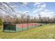 Outdoor tennis court, perfect for a friendly match or serious training, surrounded by well-maintained greenery at 1245 Periwinkle Dr, Waxhaw, NC 28173